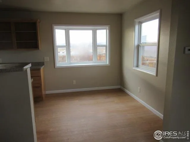 an empty room with windows