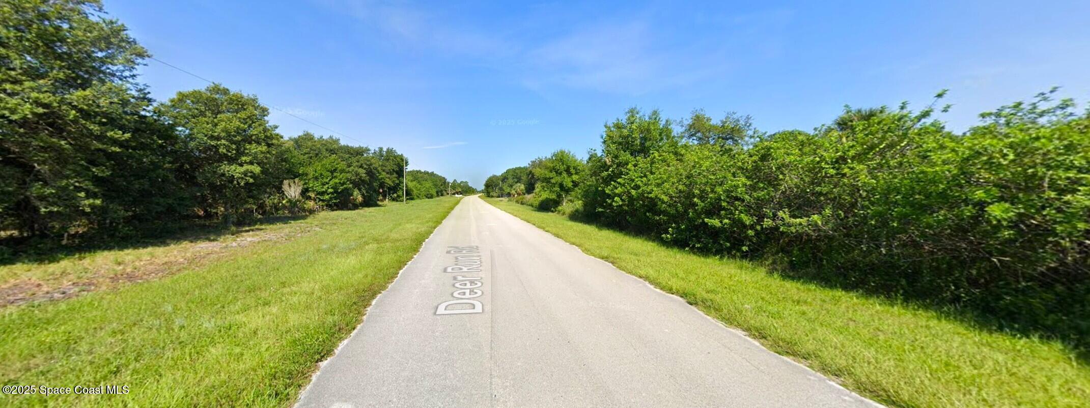 154 Deer Run Road Palm Bay, FL 32909 - Photo 5 of 5 a view of a lake with a outdoor space