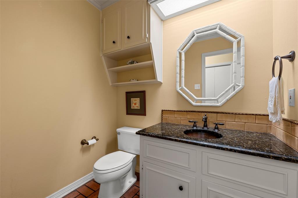 3907 Old Mill Road Waco, TX 76710 - Photo 12 of 30 a bathroom with a toilet sink and mirror