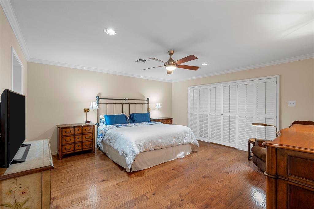 3907 Old Mill Road Waco, TX 76710 - Photo 14 of 30 a bedroom with a bed a flat screen tv and dresser