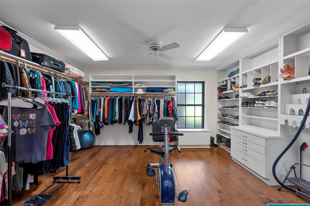 3907 Old Mill Road Waco, TX 76710 - Photo 16 of 30 a view of walk in closet with clothes and shoes