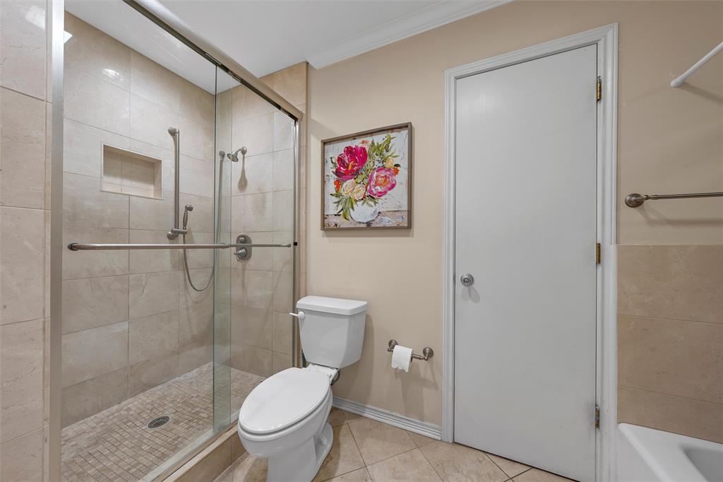 3907 Old Mill Road Waco, TX 76710 - Photo 17 of 30 a bathroom with a toilet and a shower