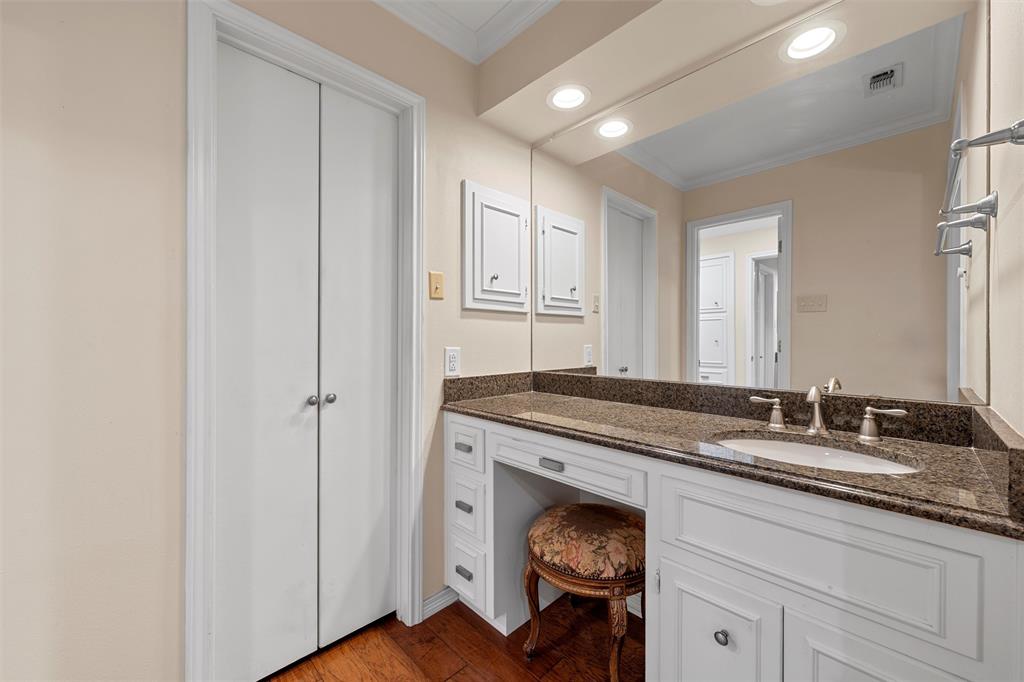 3907 Old Mill Road Waco, TX 76710 - Photo 18 of 30 a en suite bathroom with a granite countertop sink and a mirror