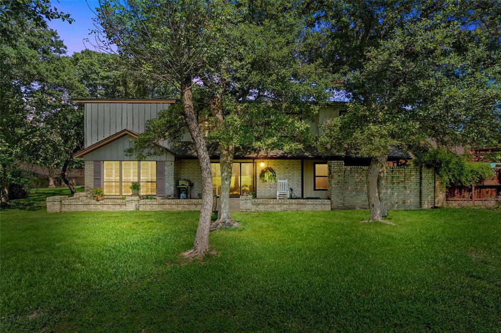 3907 Old Mill Road Waco, TX 76710 - Photo 25 of 30 a front view of a house with a yard and trees