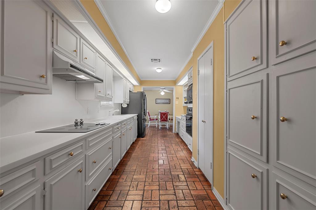 3907 Old Mill Road Waco, TX 76710 - Photo 8 of 30 a large white kitchen with stainless steel appliances
