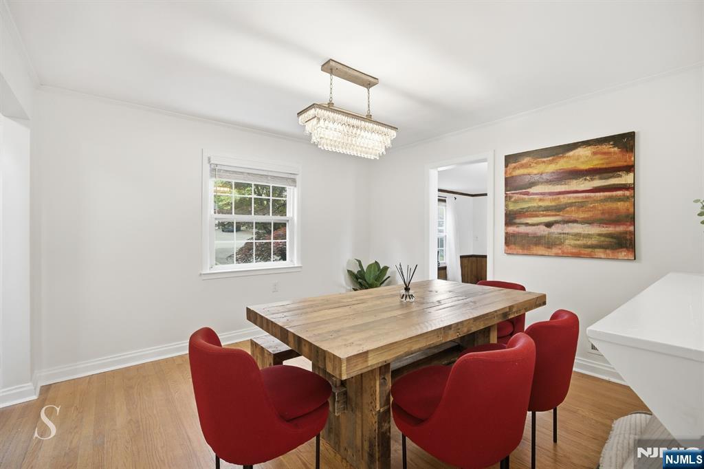 440 Kinderkamack Road River Edge, NJ 07661 - Photo 2 of 31 a view of a dining room with furniture window and wooden floor