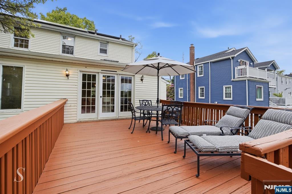 440 Kinderkamack Road River Edge, NJ 07661 - Photo 10 of 31 a view of a house with wooden deck and furniture