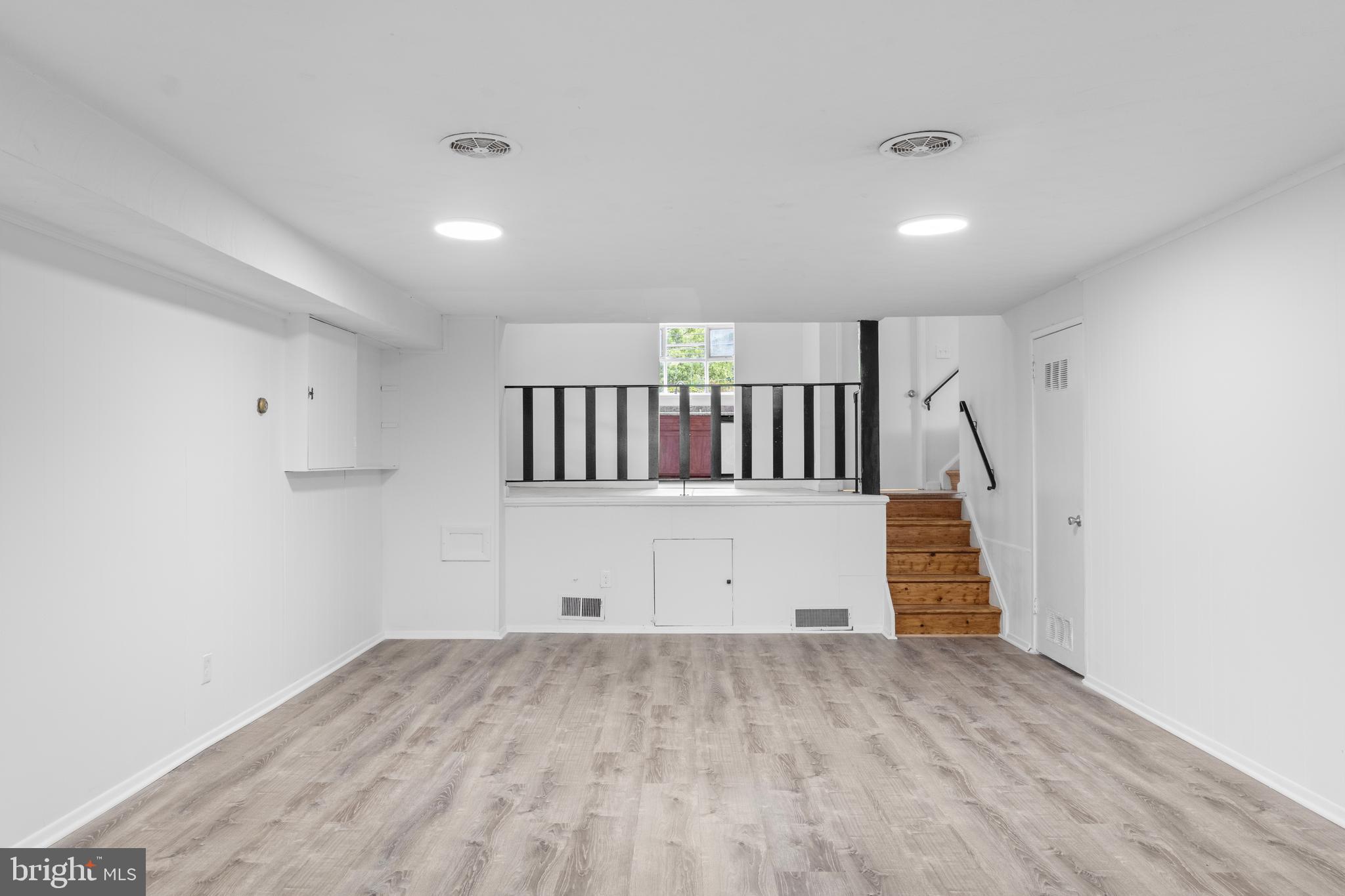 2302 Veirs Mill Road Rockville, MD 20851 - Photo 22 of 34 Family room with storage and access to basement