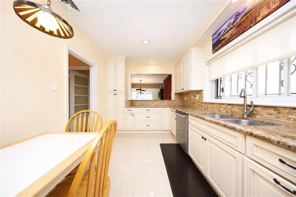1 Bay Ridge Parkway Brooklyn, NY 11209 - Photo 16 of 38 a large white kitchen with a large window