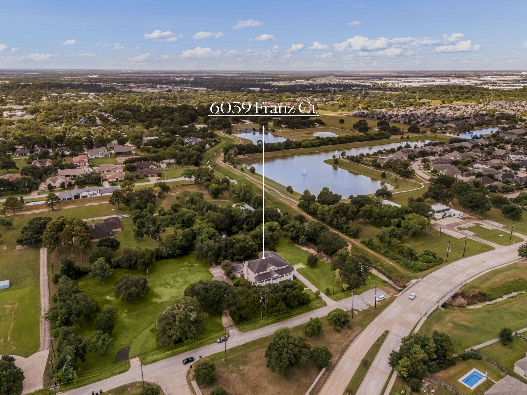 6039 Franz Road Katy, TX 77493 - Photo 47 of 49 This aerial view highlights the estate's setting just off a main thoroughfare, offering quick access to the surrounding community while maintaining a private, tree-buffered position on its own acreage.