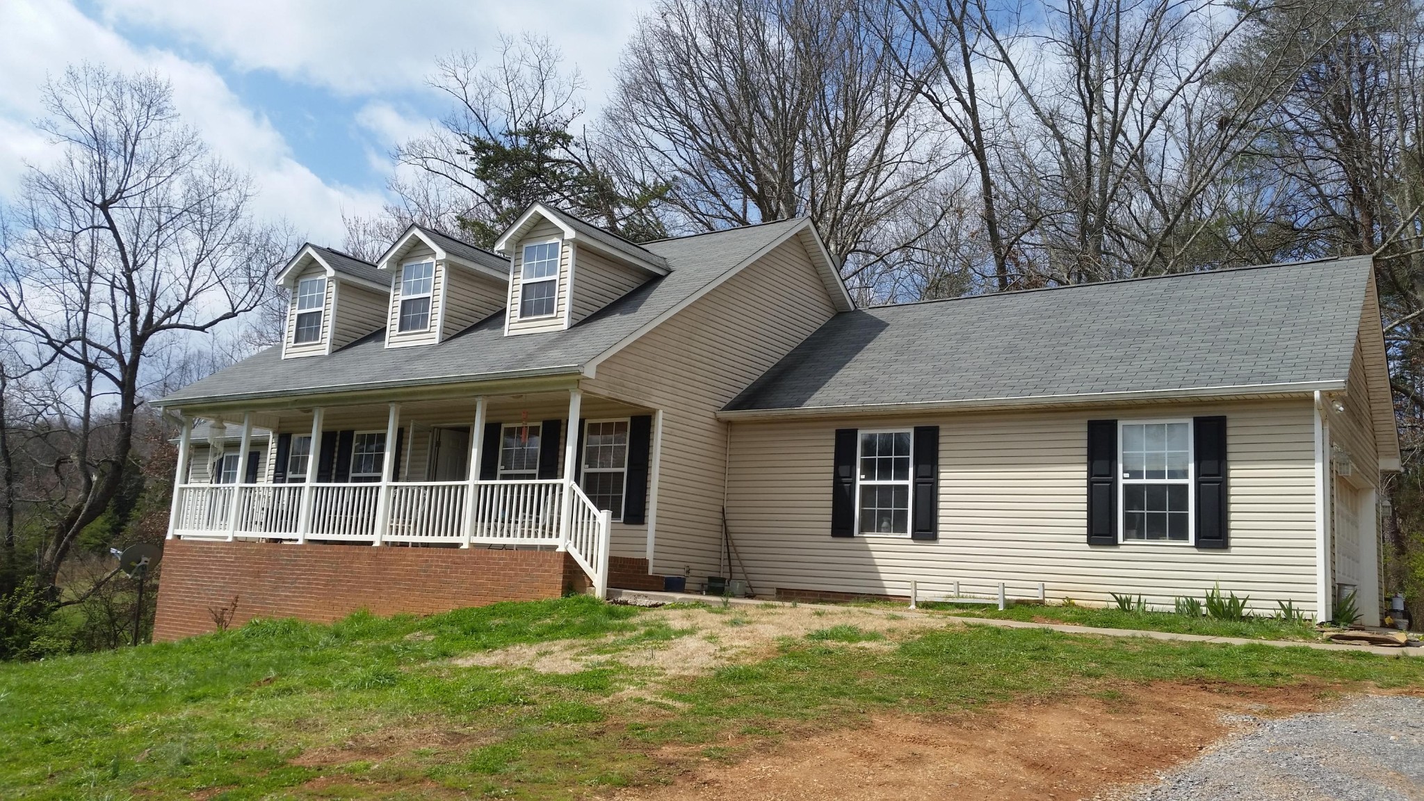 front view of a house with a yard