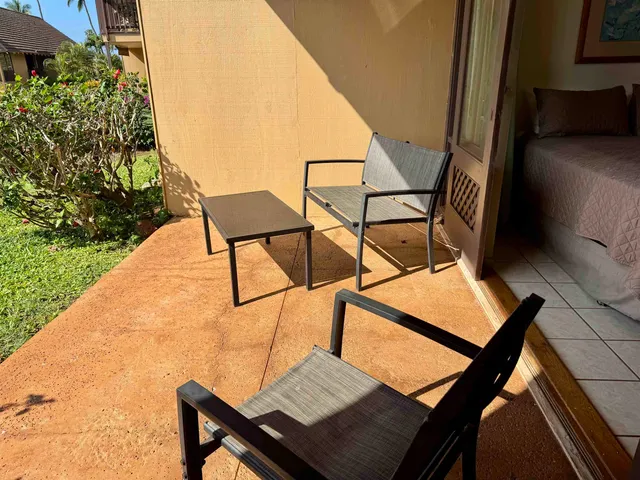 a terrace of a house with outdoor seating