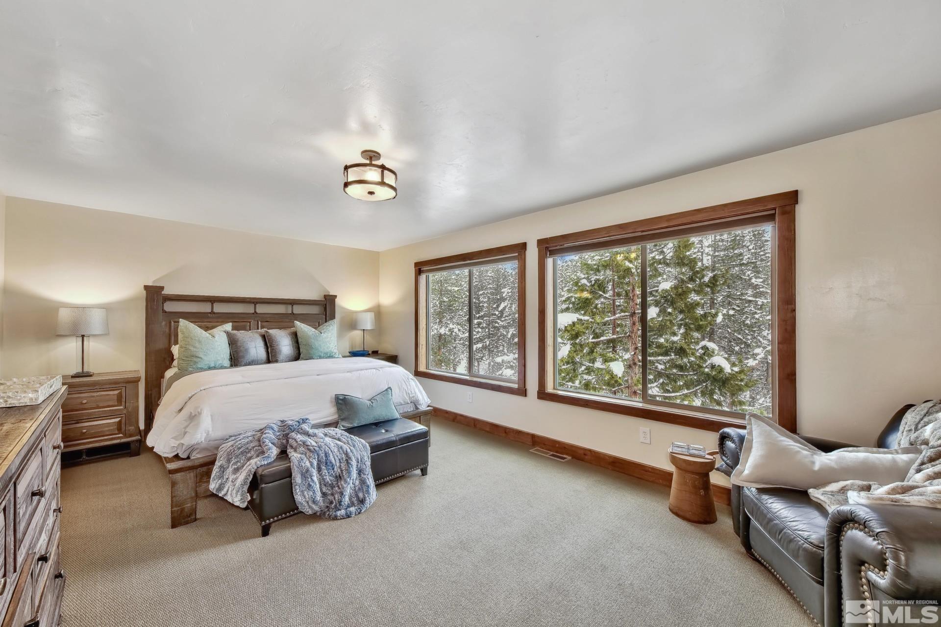 333 Ute Way Stateline, NV 89449 - Photo 22 of 40 a bedroom with a bed and a large window