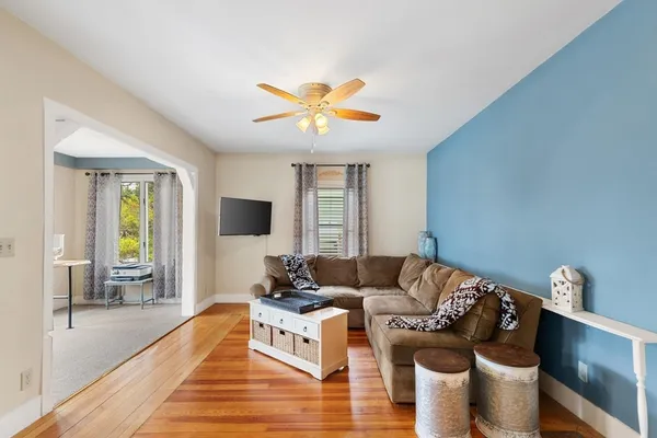 a living room with furniture and a flat screen tv