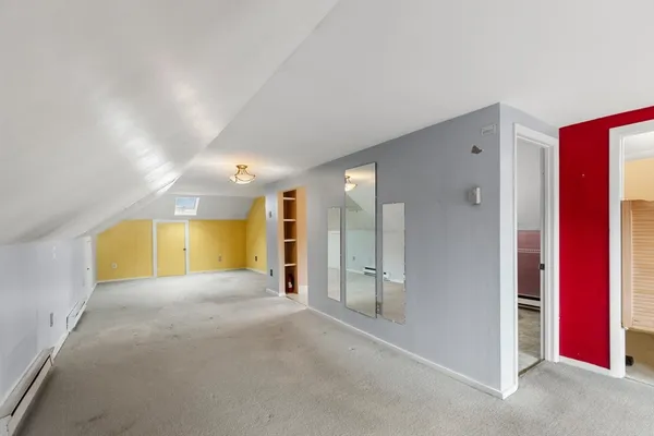 a view of empty room with a bathroom