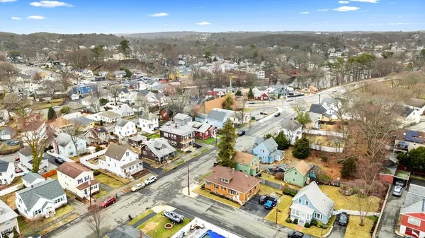 an aerial view of residential building with parking