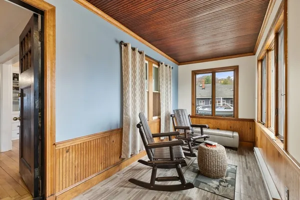 a dining room with furniture and windows
