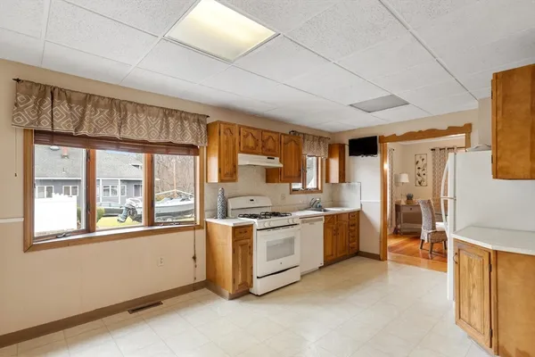a kitchen with stainless steel appliances granite countertop a stove and a refrigerator