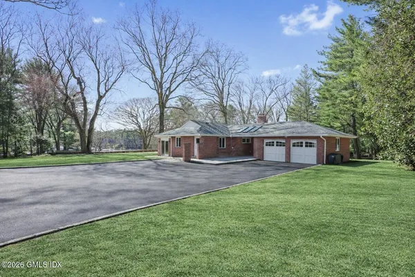 a house view with a garden space