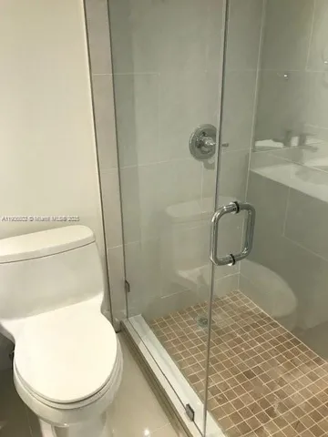 a bathroom with a toilet and a sink