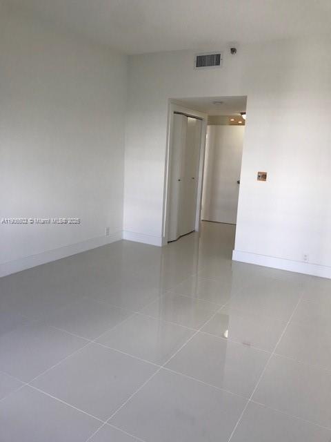 251 Crandon Boulevard, Unit 535 Key Biscayne, FL 33149 - Photo 5 of 14 an empty room with an entrance to other room