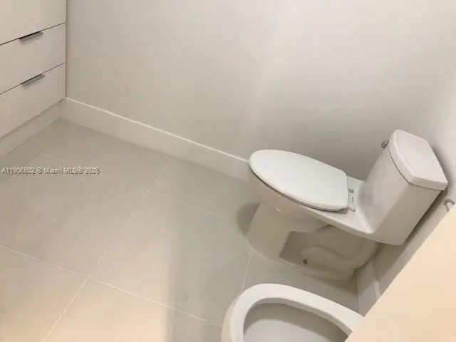a bathroom with a toilet and sink