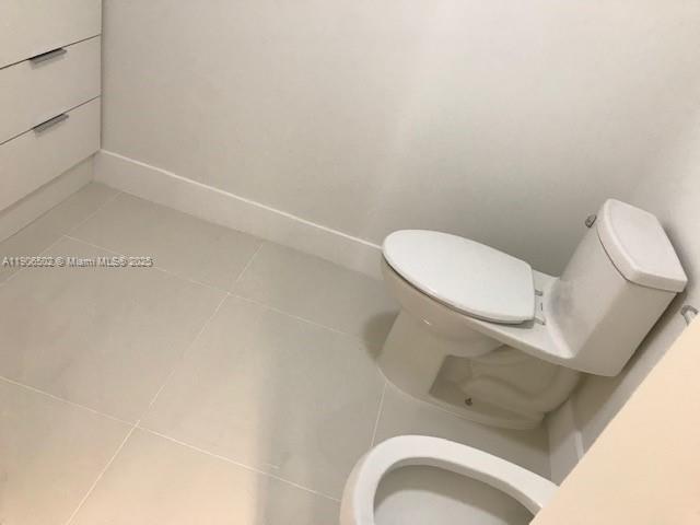 251 Crandon Boulevard, Unit 535 Key Biscayne, FL 33149 - Photo 10 of 14 a bathroom with a toilet and sink