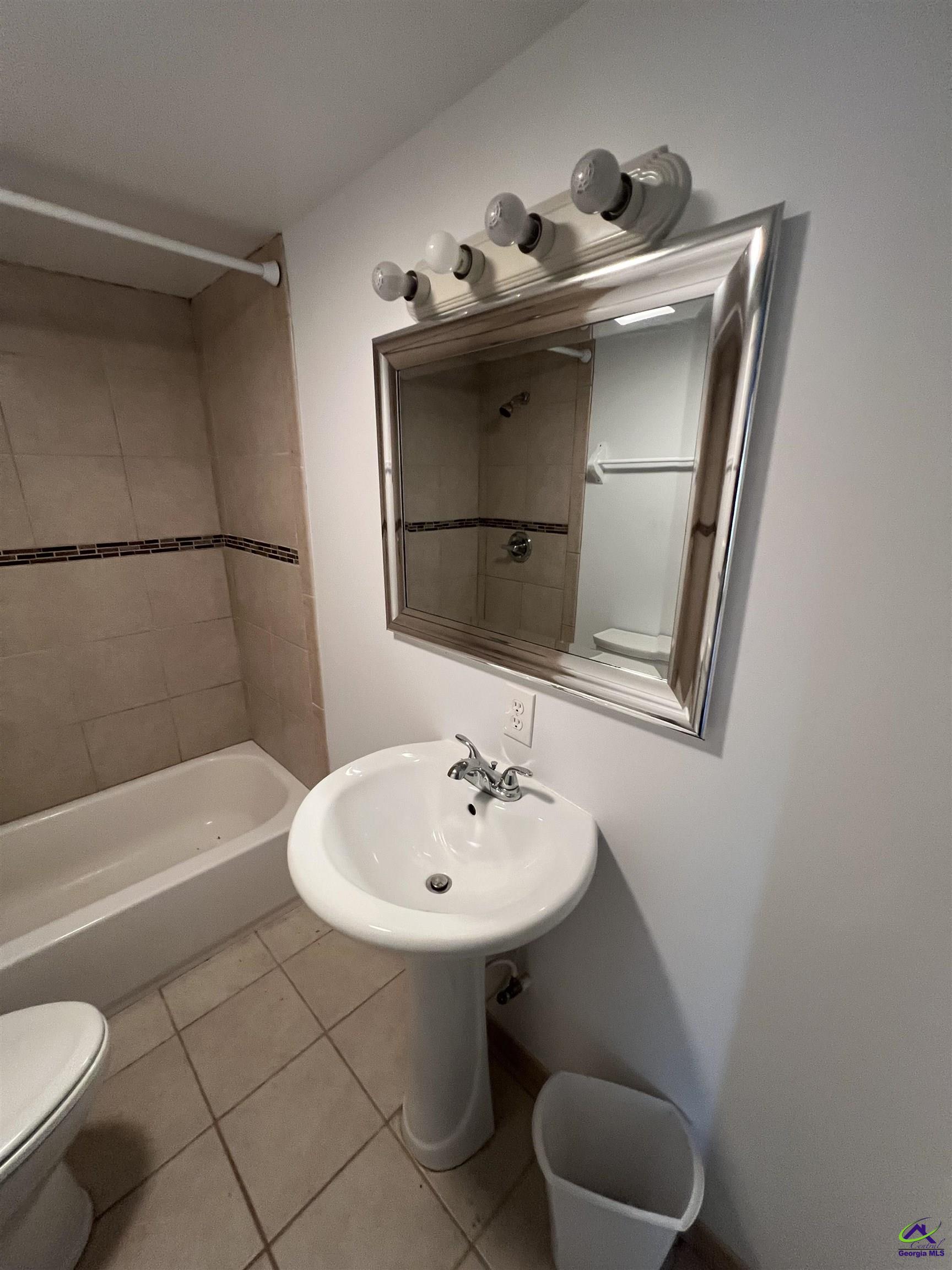 3281 State Rte 126 Dublin, GA 31021 - Photo 14 of 22 a bathroom with a sink toilet and shower