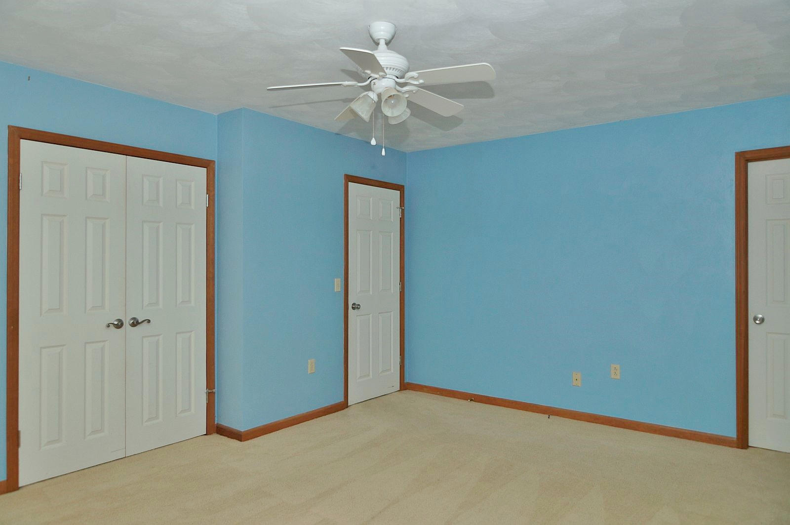 35 Oak Leaf Drive Blue Ridge, VA 24064 - Photo 16 of 36 an empty room with a ceiling fan and a window