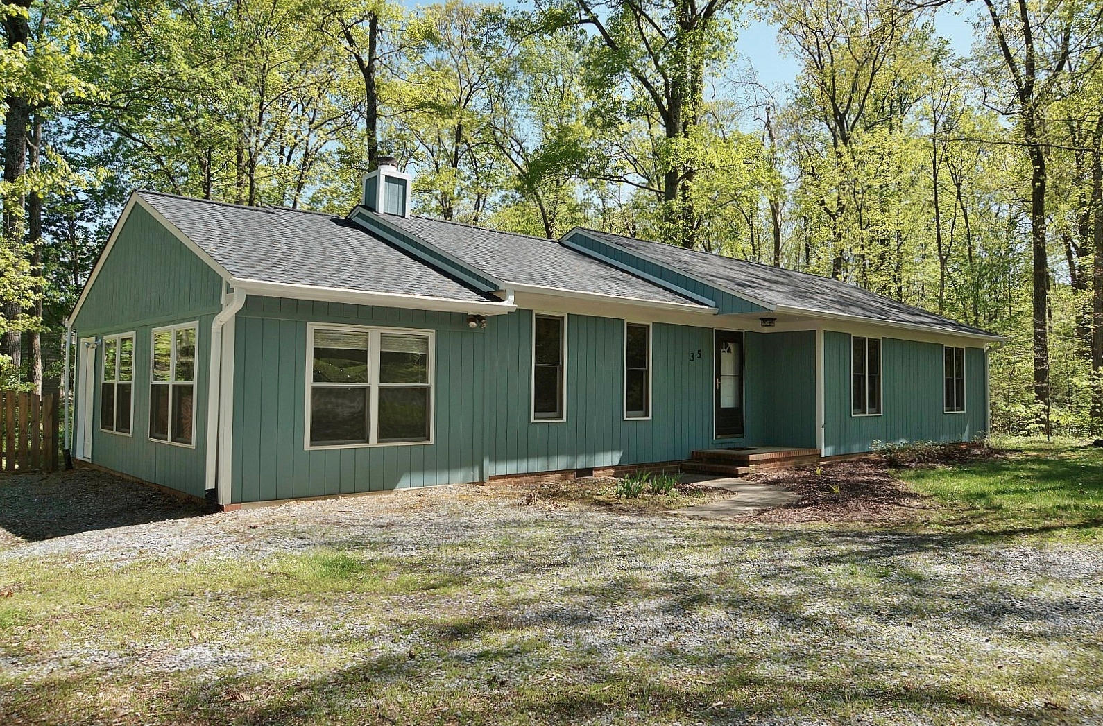 35 Oak Leaf Drive Blue Ridge, VA 24064 - Photo 2 of 36 a front view of a house with a garden