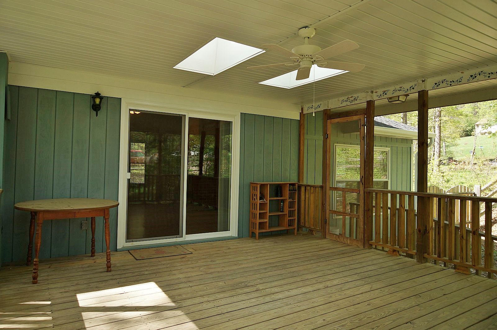 35 Oak Leaf Drive Blue Ridge, VA 24064 - Photo 30 of 36 an empty room with wooden floor and windows