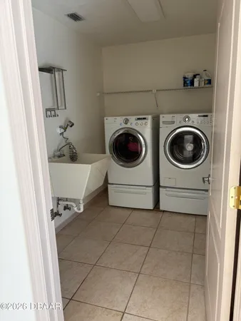 a utility room with dryer and washer