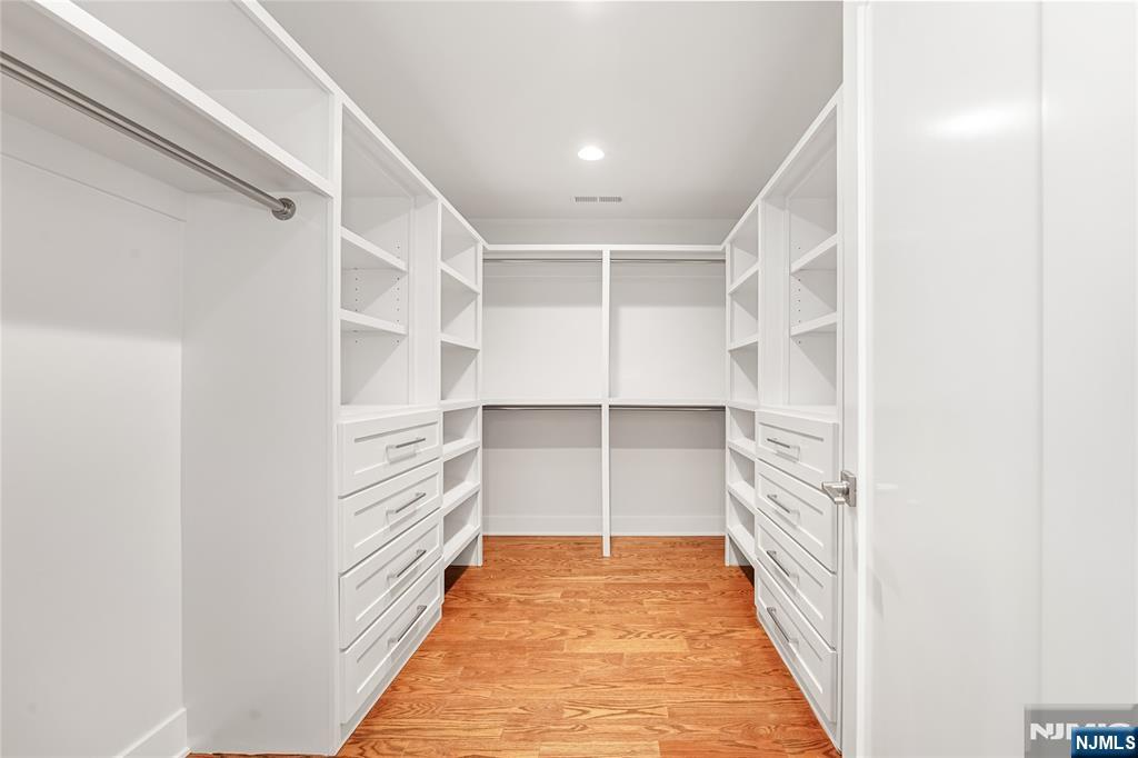 1 Lourdes Court Andover, NJ 07821 - Photo 24 of 40 a view of walk in closet with empty racks