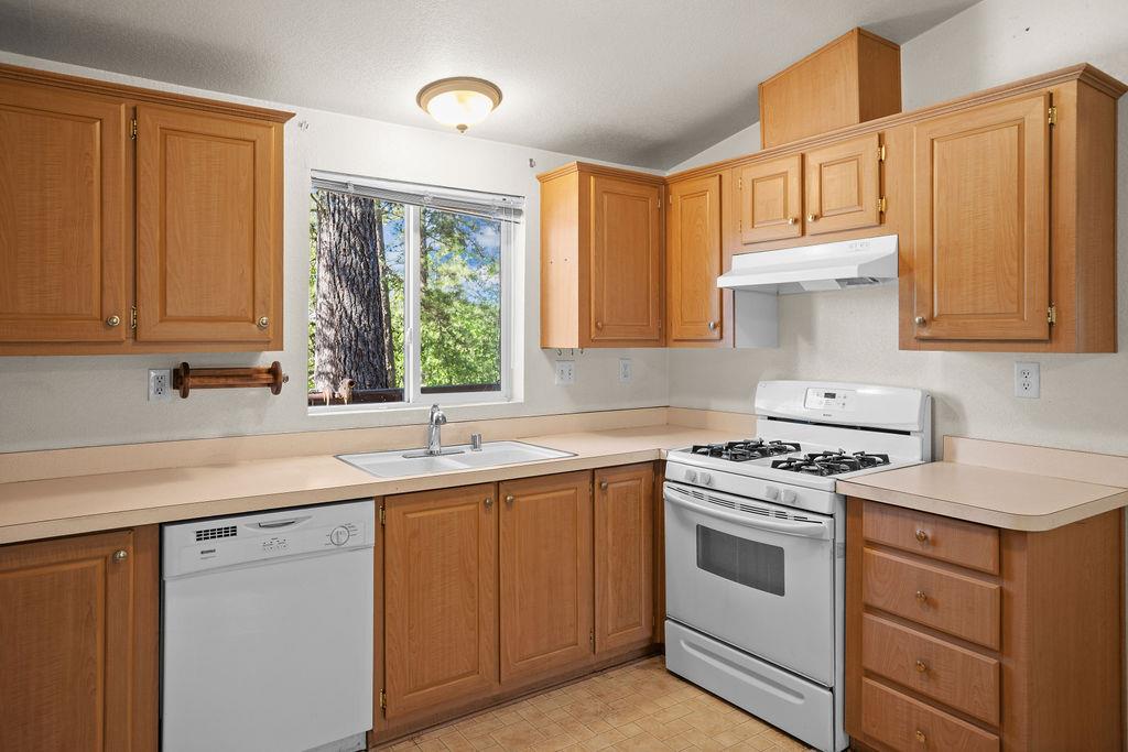 1281 Pleasant Valley Road, Unit 44 Diamond Springs, CA 95619 - Photo 8 of 27 a kitchen with a sink stove and cabinets