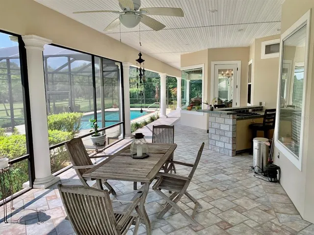 a view of a dining room with furniture wooden floor and chandelier