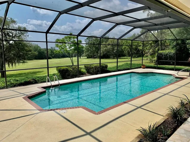 a view of a backyard with sitting area
