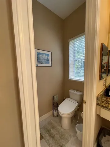 a bedroom with furniture and a chandelier