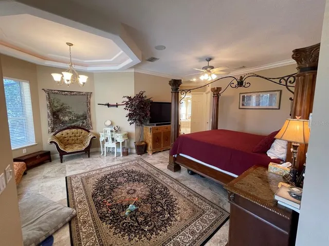 a bed room with a bed and a television