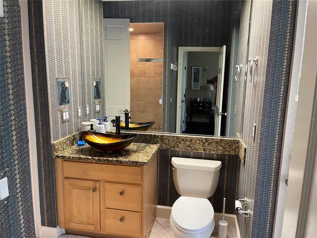 a bathroom with a sink and mirror