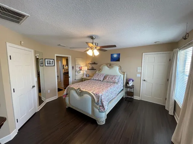 a view of a livingroom with furniture window and wooden floor