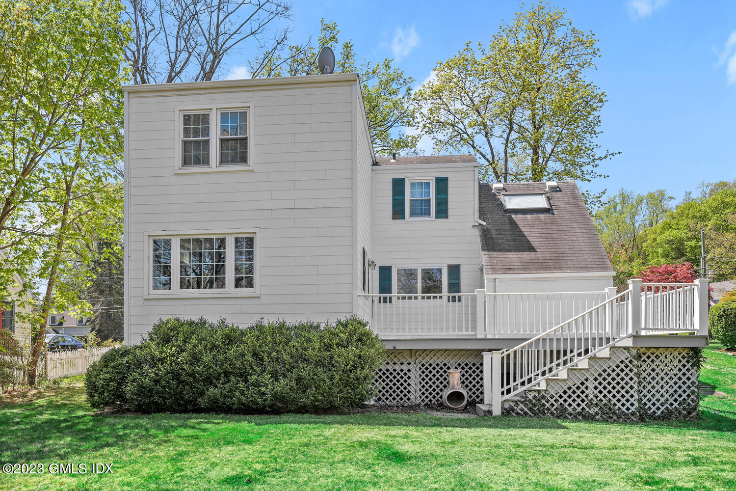 5 Linwood Avenue Riverside, CT 06878 - Photo 12 of 16 a front view of a house with a garden