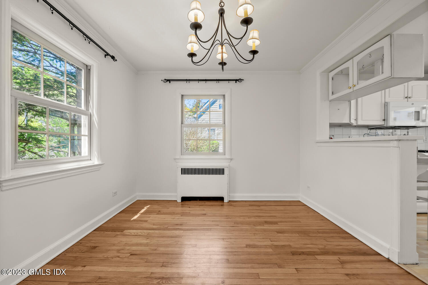 5 Linwood Avenue Riverside, CT 06878 - Photo 3 of 16 a view of empty room with wooden floor and fan