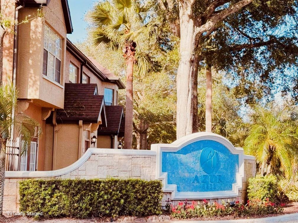 a wooden bench sitting in front of a building