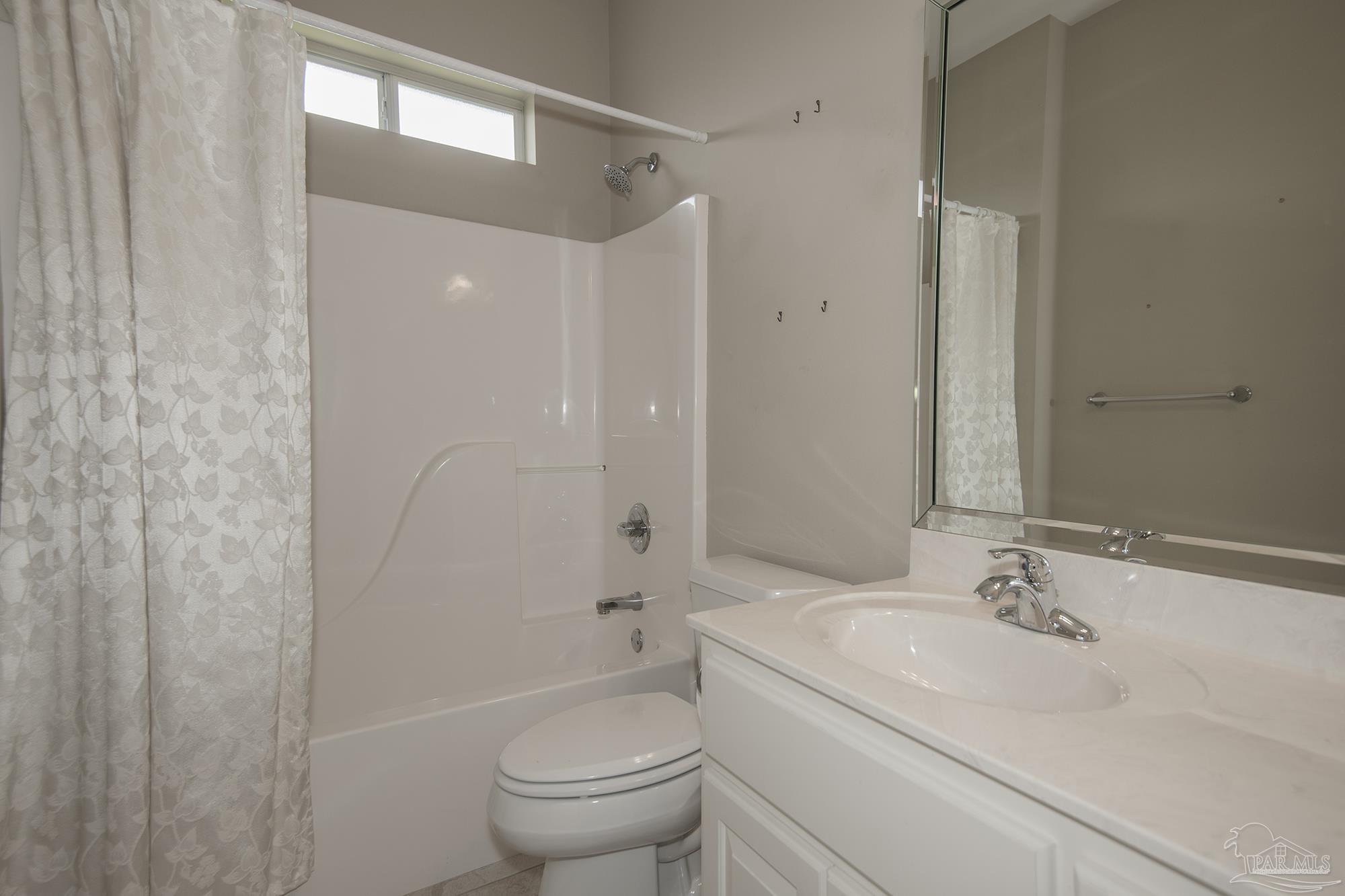 3200 Silverleaf Drive Pensacola, FL 32504 - Photo 22 of 38 a bathroom with a sink toilet and shower