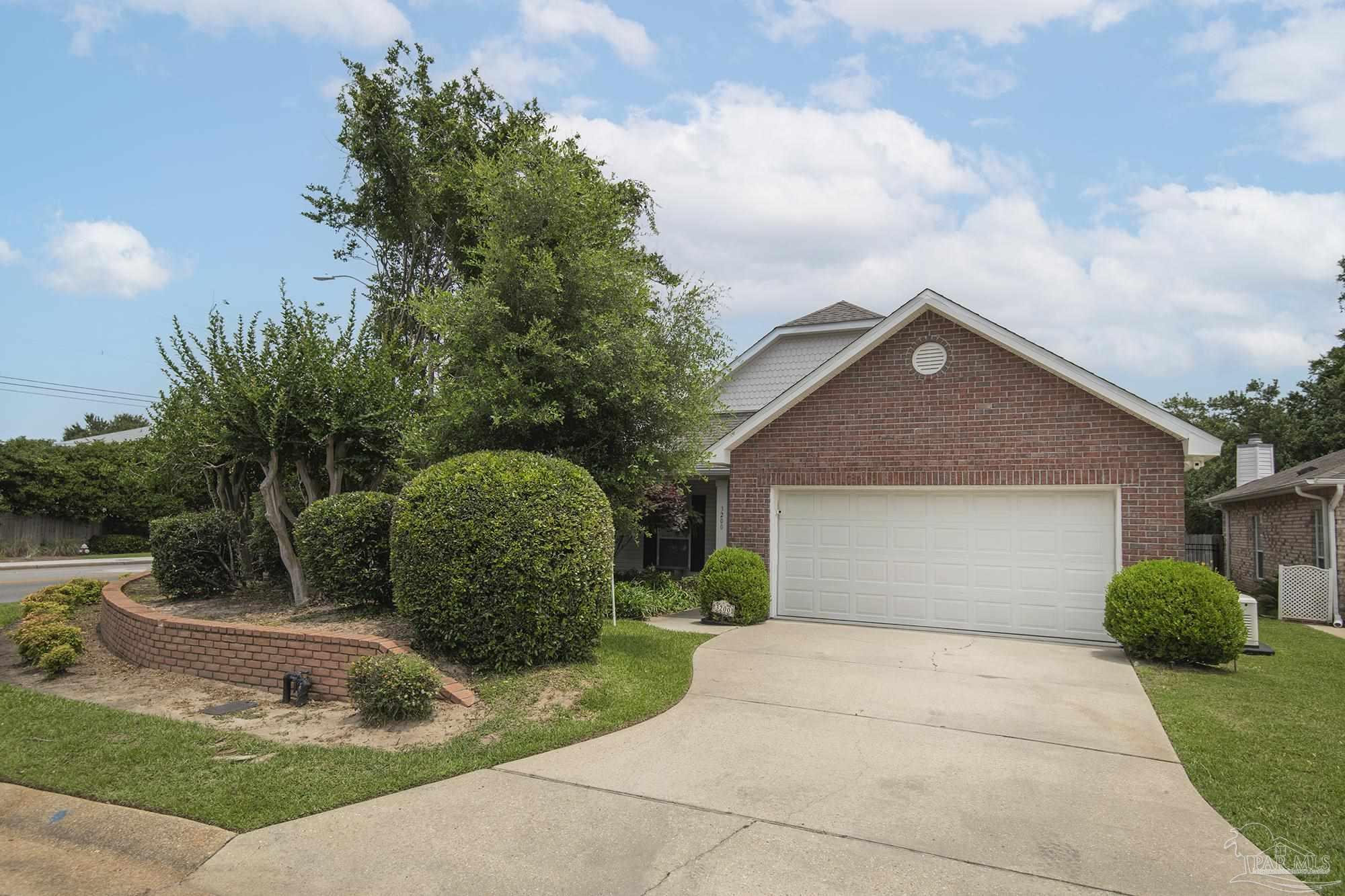 3200 Silverleaf Drive Pensacola, FL 32504 - Photo 3 of 38 a front view of a house with garden