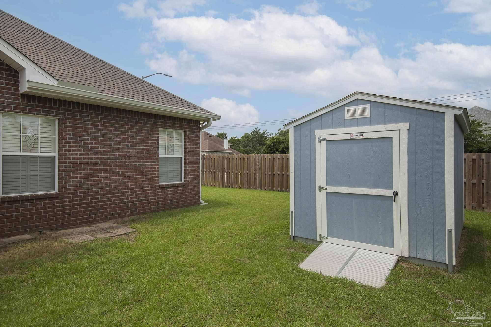 3200 Silverleaf Drive Pensacola, FL 32504 - Photo 33 of 38 a front view of a house with a yard