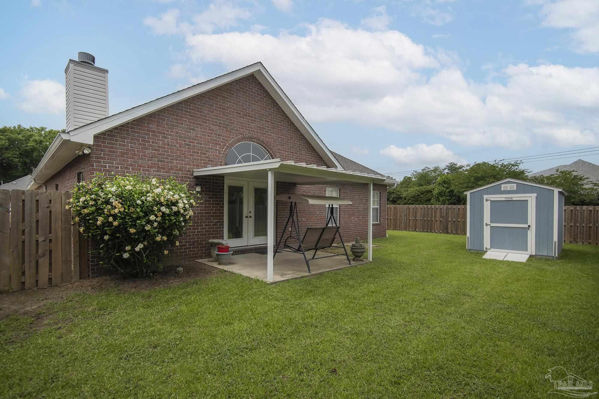 3200 Silverleaf Drive Pensacola, FL 32504 - Photo 34 of 38 a front view of a house with garden
