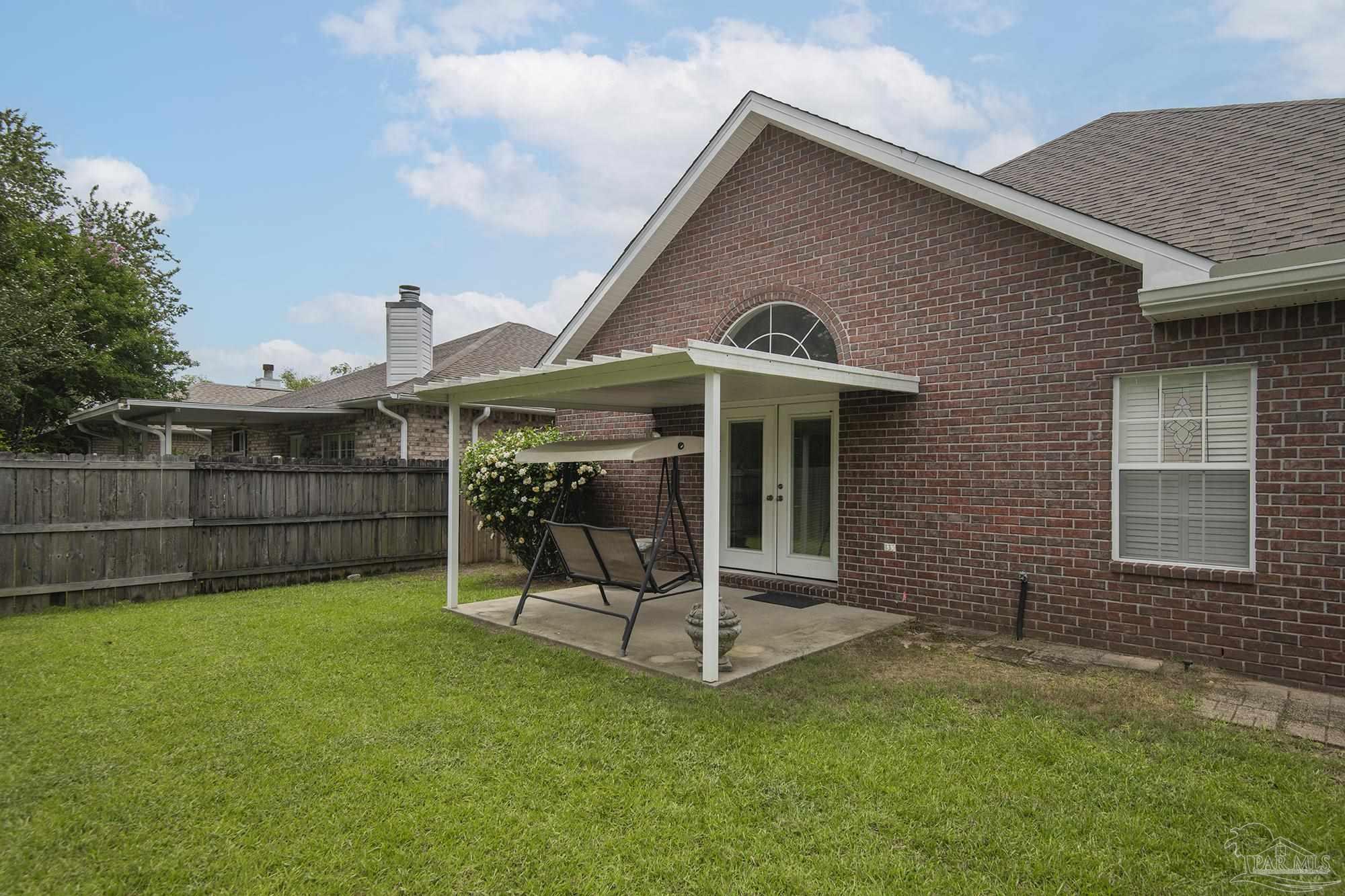 3200 Silverleaf Drive Pensacola, FL 32504 - Photo 35 of 38 a view of a house with a yard and sitting area