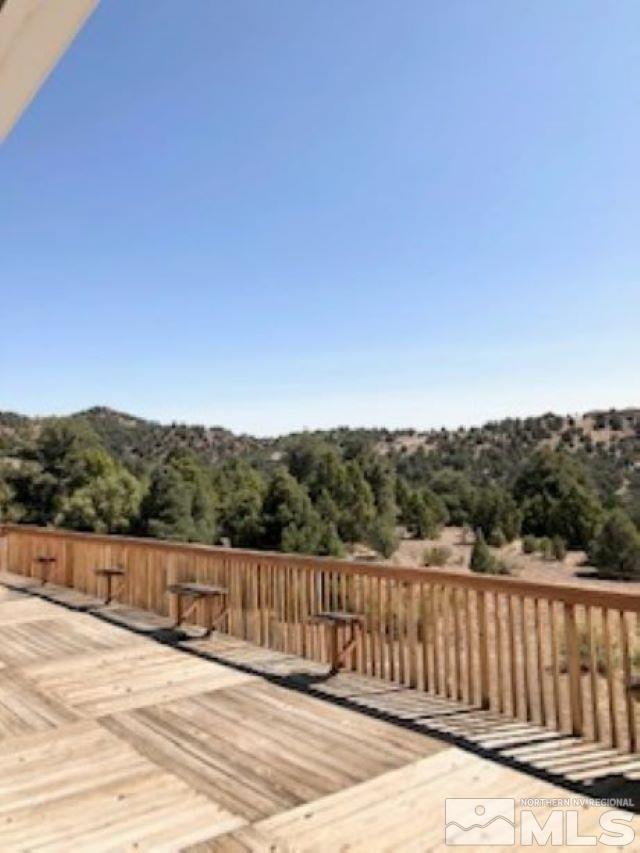 2640 Castle Peak Road Reno, NV 89521 - Photo 16 of 25 a view of a balcony with wooden fence and floor