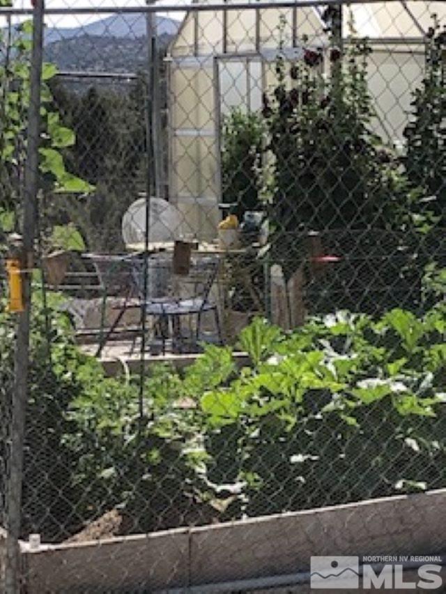 2640 Castle Peak Road Reno, NV 89521 - Photo 20 of 25 a backyard of a house with lots of green space and fountain